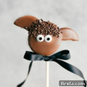 Bat Oreo Pop, a delightful and easy Halloween treat featuring chocolate-dipped Oreos and candy eyes.