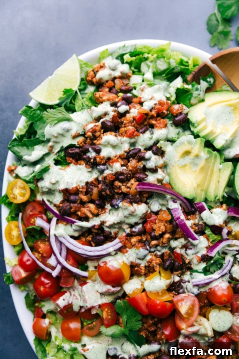 Vibrant and colorful turkey taco salad, fully dressed and ready to serve.