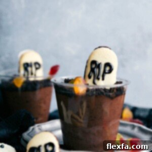 Graveyard Pudding Cups with Milano cookie tombstones and gummy worms.