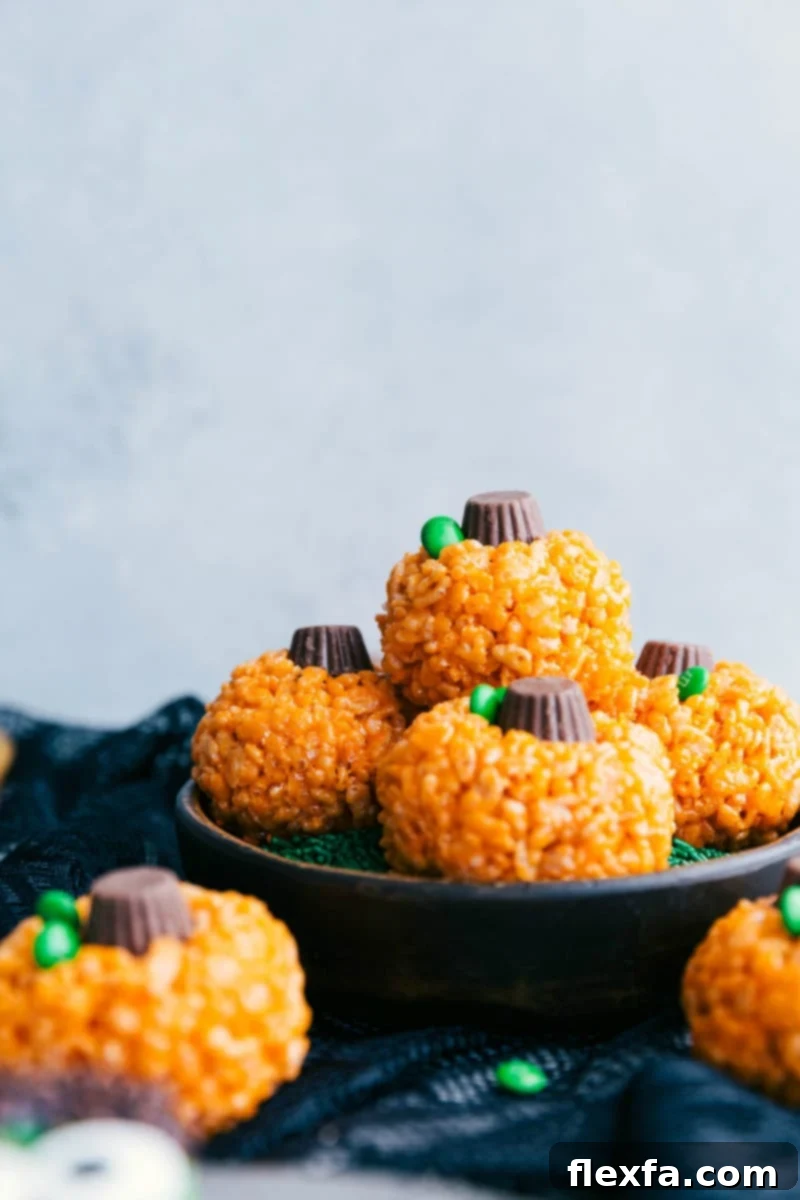 Image of the pumpkin krispies treats stacked on top of eachother, that go along with the other halloween rice krispie treats