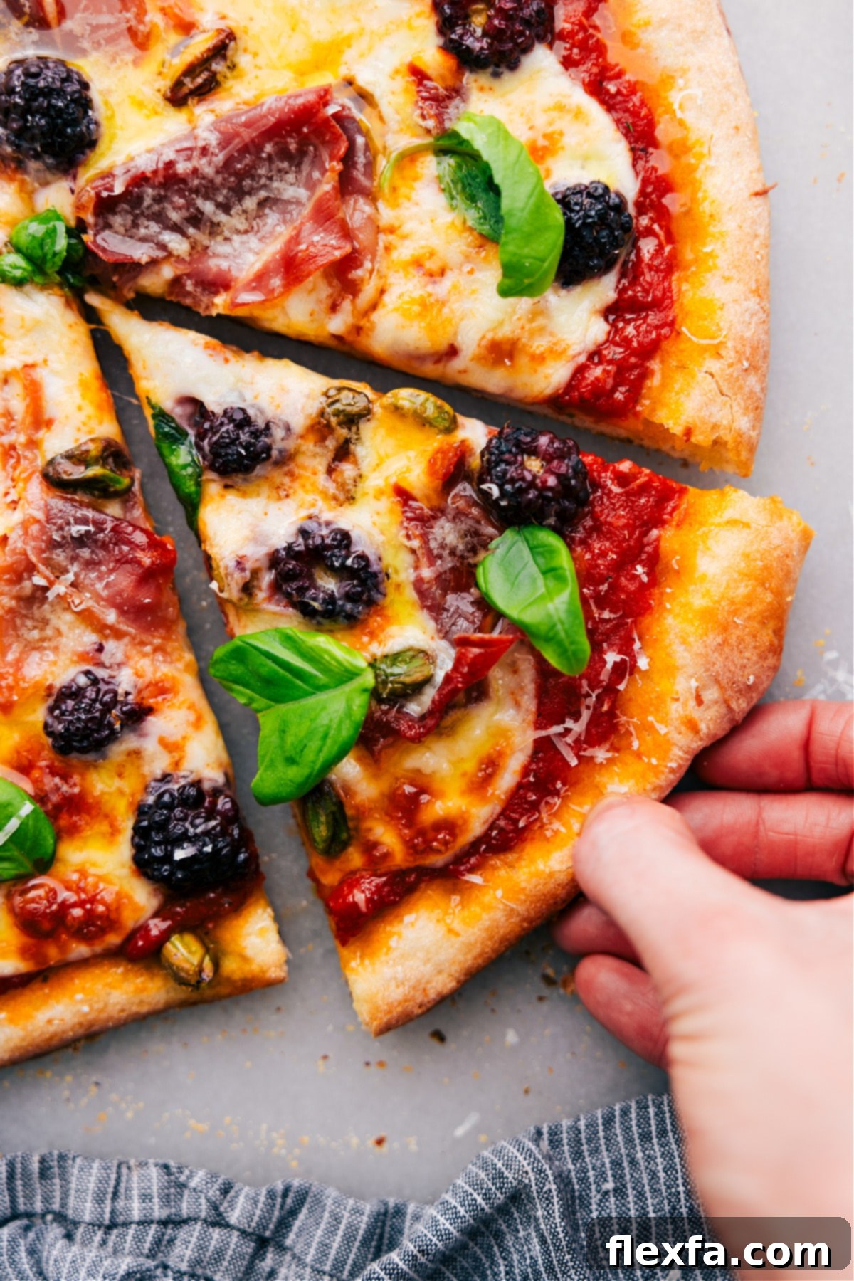 How To Make Blackberry Basil Pizza: Your Guide to a Gourmet Treat A perfectly baked slice of Blackberry Basil Pizza, featuring a crispy crust, melted mozzarella, vibrant blackberries, and fresh basil, ready to be enjoyed.
