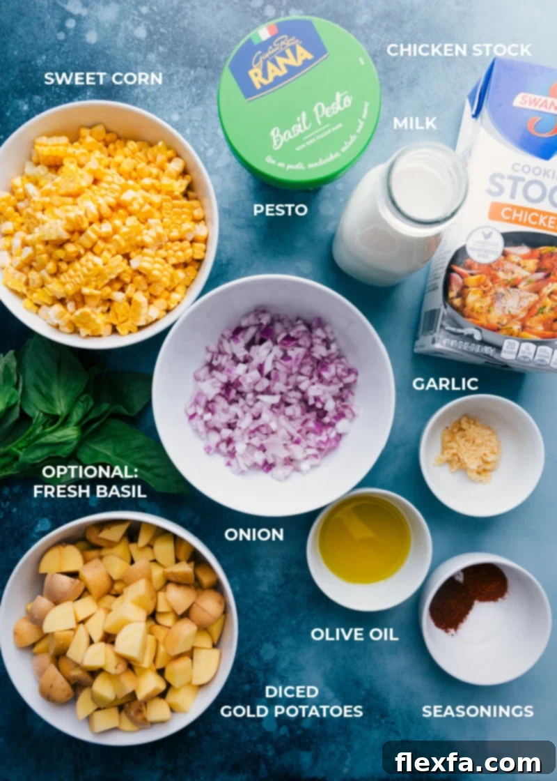 Potato Corn Chowder combines the best of summer produce -- sweet corn with fresh basil and pesto! This hearty, creamy, thick soup is simple to make and a total crowd pleaser! Recipe via ChelseasMessyApron.com #dinner #quick #easy #simple #best #creamy #summer #potato #corn #chowder A flat lay image showing all the fresh ingredients for Potato Corn Chowder: corn on the cob, red onion, Yukon gold potatoes, garlic, spices, milk, and pesto.