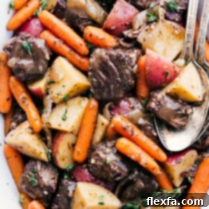 Finished Crockpot Roast Recipe with gravy and herbs.