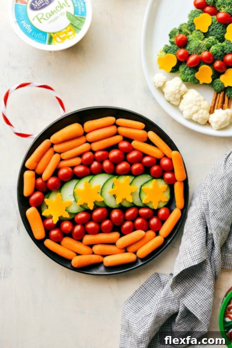 A creative and elegant holiday ornament design crafted entirely from an assortment of vibrant and fresh vegetables, including bright red cherry tomatoes, crisp cucumber slices, and sweet mini carrots, all beautifully arranged on a serving platter.
