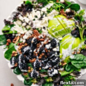 Blackberry Salad in a bowl with dressing