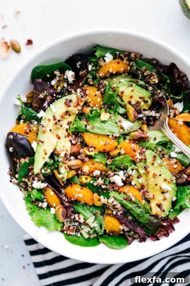 An inviting, close-up overhead shot of the Citrus Quinoa Salad, beautifully arranged in a serving bowl and ready for consumption, emphasizing its fresh, vibrant ingredients and appealing presentation.