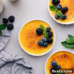 Golden crème brûlées with a crisp sugary top, garnished with fresh fruit, presented beautifully for serving.