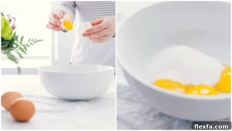The delicate process of separating bright yellow egg yolks into a clean mixing bowl, with granulated sugar nearby, illustrating the initial steps for Crème Brûlée preparation.