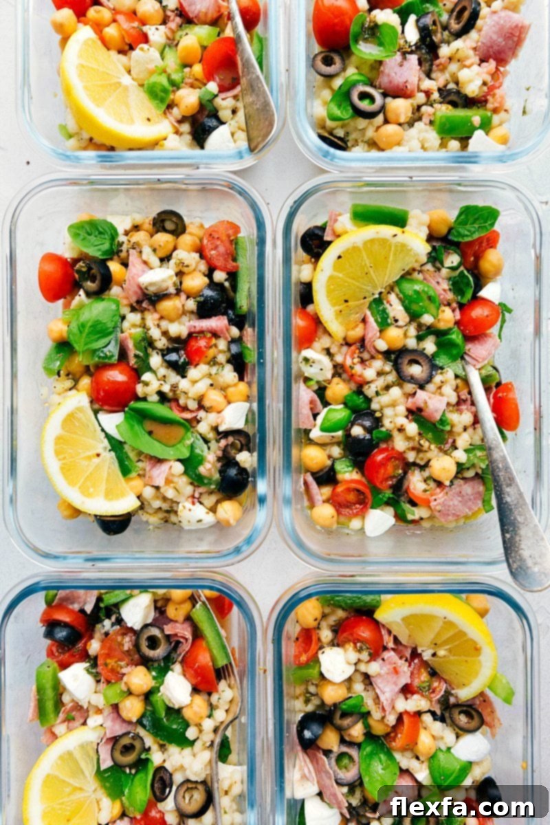 Individual meal prep containers filled with Italian Couscous Salad, perfectly portioned for a week of healthy lunches.