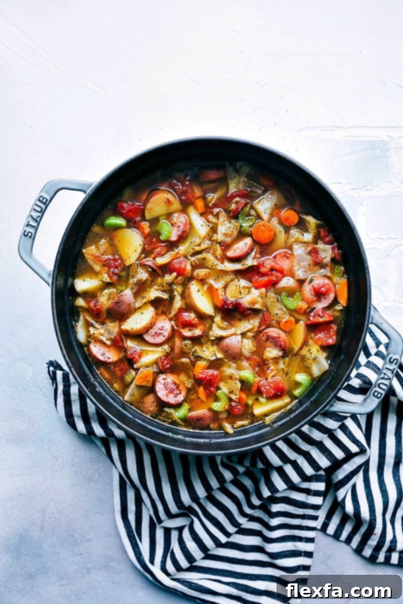 Hearty Sausage Cabbage and Potato Soup 3 A thick and hearty sausage, potato, and cabbage soup; a healthy recipe that is packed with flavorful ingredients! chelseasmessyapron.com | #cabbage #soup #sausage #healthy #easy #quick #cabbagesoup #celery #carrots #potatoes