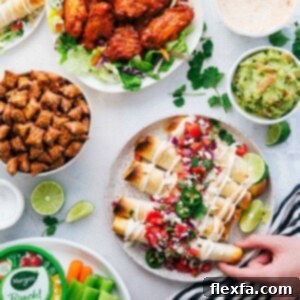 Crispy Baked Chicken Taquitos with various toppings on a platter.