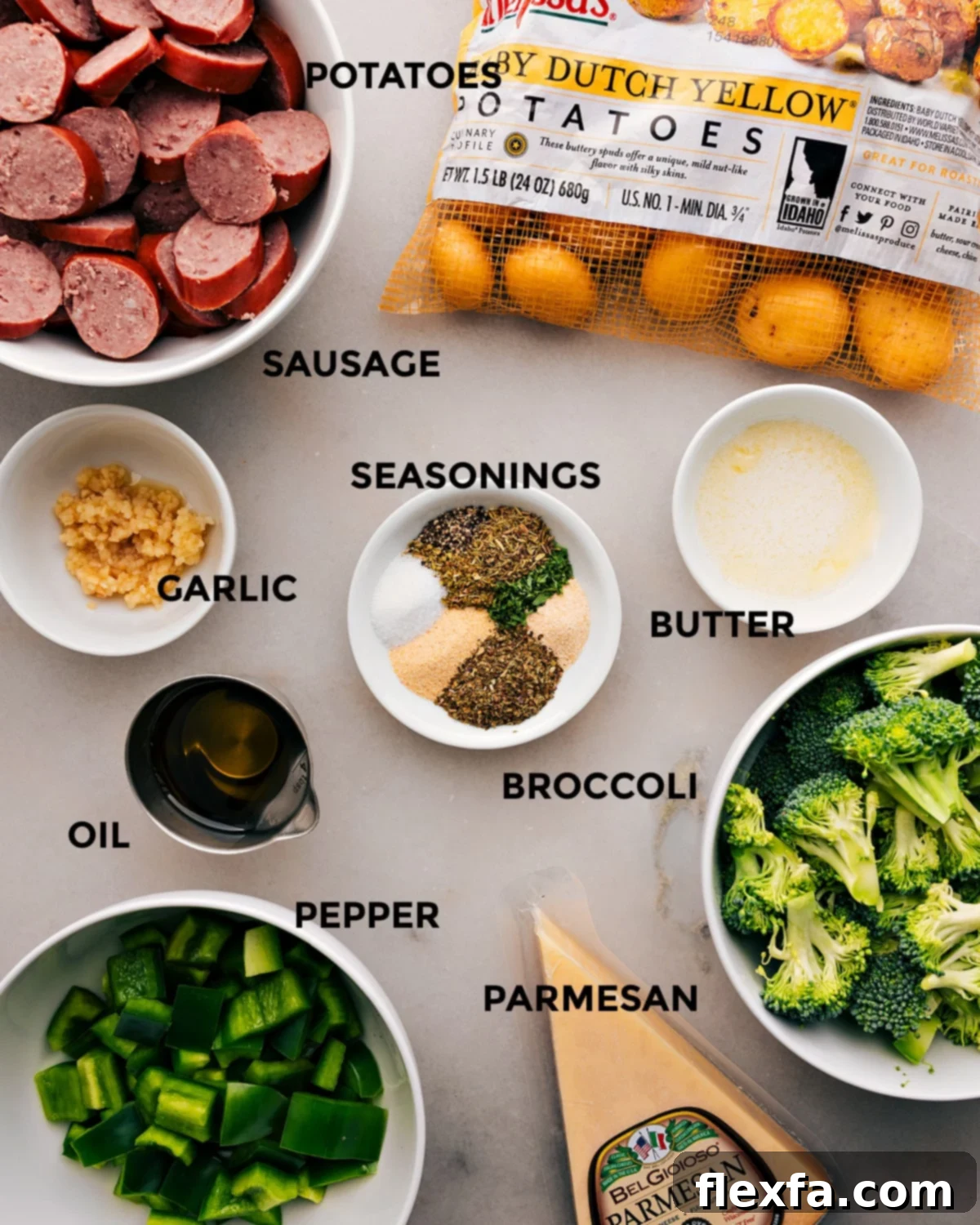 All the fresh ingredients for the Sausage Potato Broccoli Sheet Pan recipe, prepped and ready for assembly.