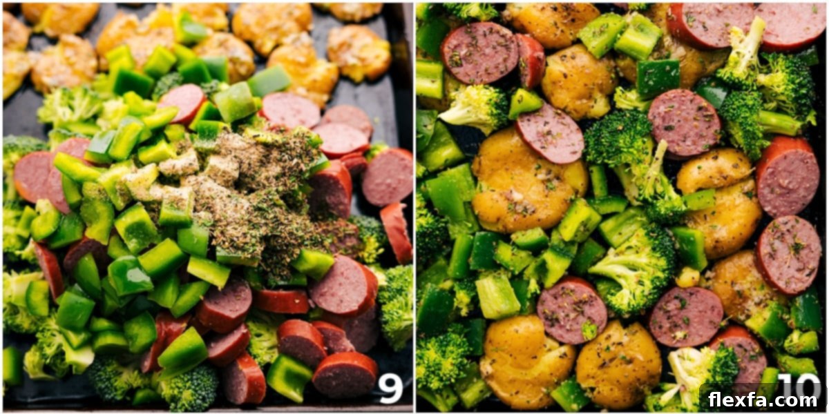 Sausage, potatoes, and broccoli being tossed together on a large sheet pan, ready for roasting.