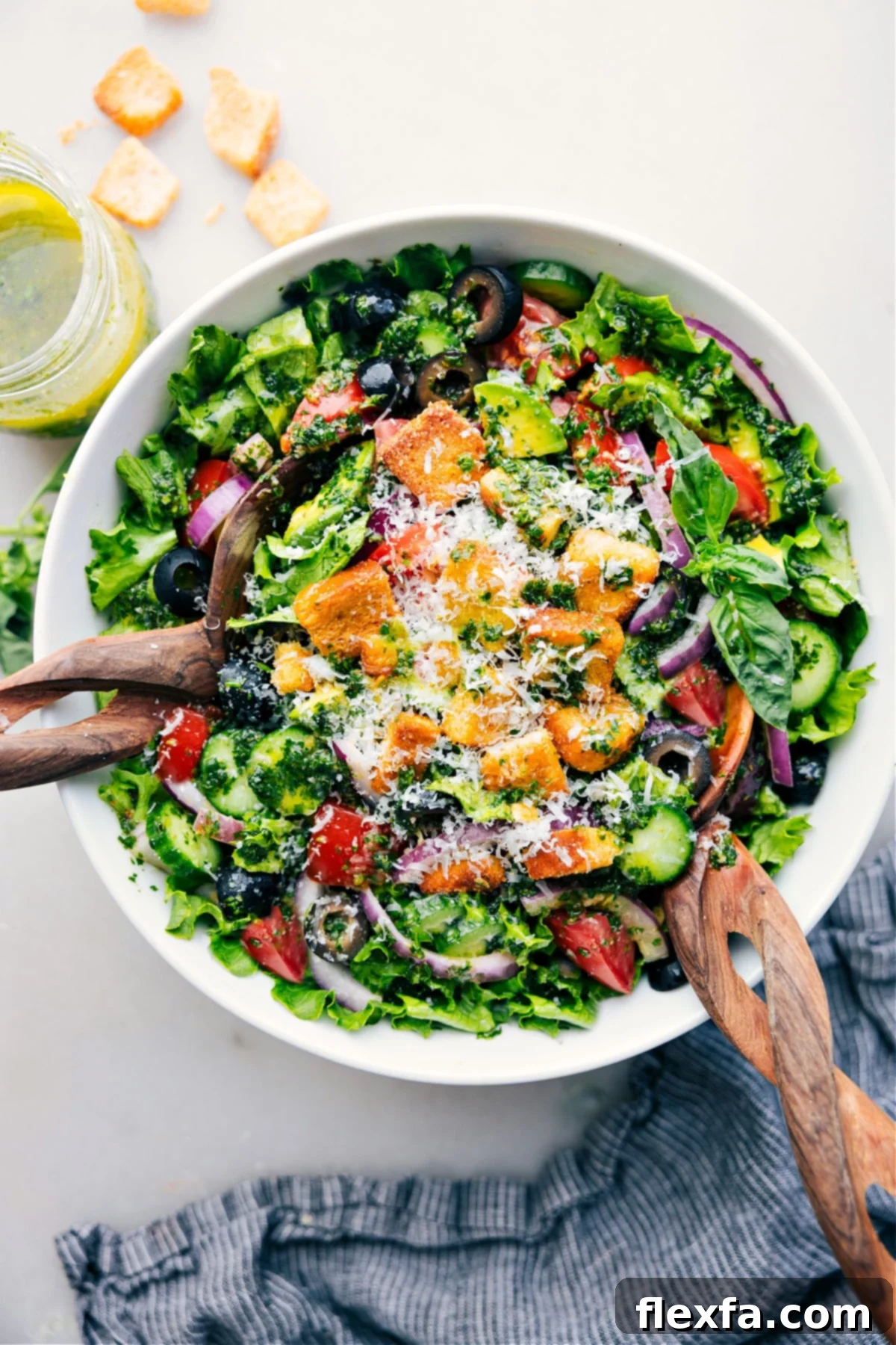 A large bowl of fresh Italian Salad with vibrant vegetables and croutons, ready to be served.