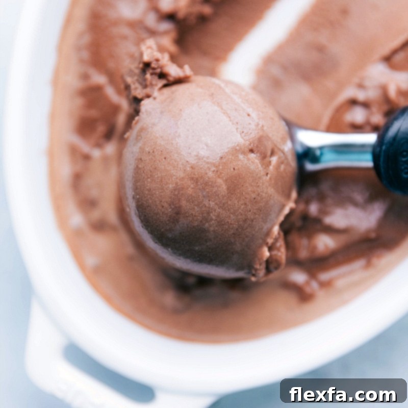 A scoop of refreshing and flavorful homemade gelato being served, showcasing its creamy texture.