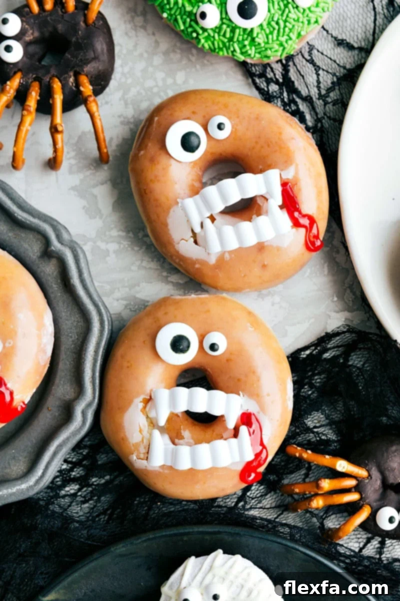 A terrifyingly delicious Vampire Halloween Donut, complete with candy eyes and plastic fangs dripping with edible red gel.