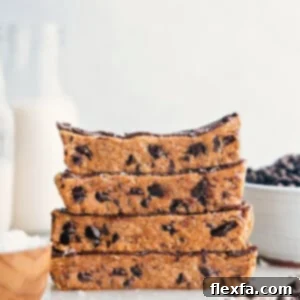 Homemade Protein Bars stacked enticingly, showcasing their appealing texture and rich color.