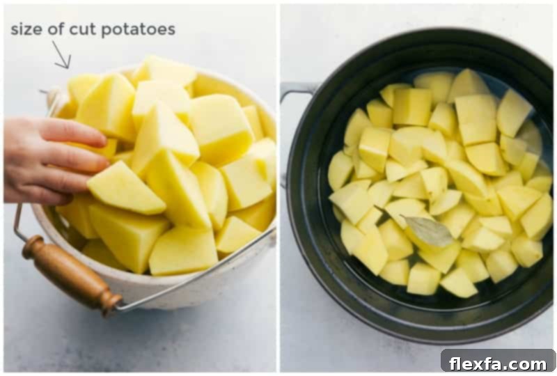 Peeled and uniformly cut potatoes submerged in cold water in a large pot, ready for boiling.