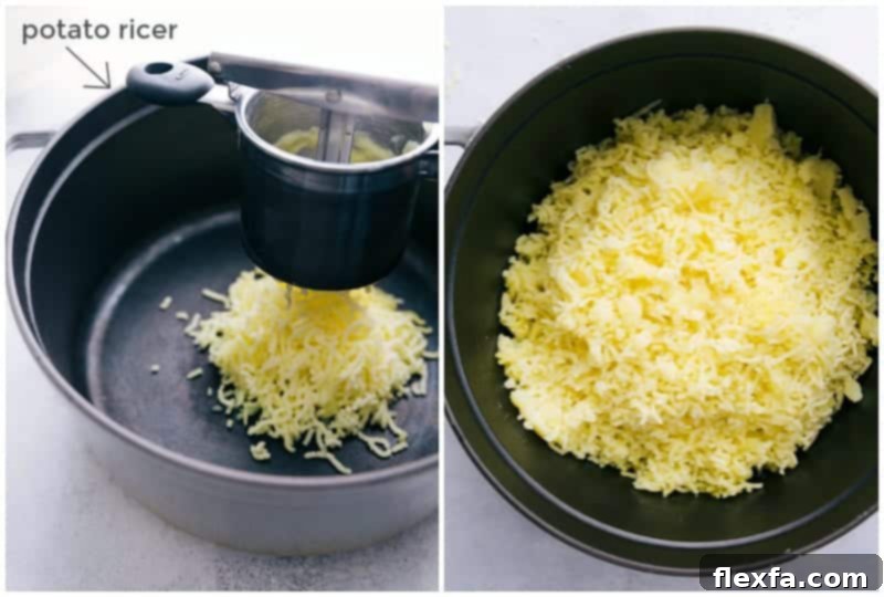 Cooked potatoes being pressed through a potato ricer, yielding a fluffy and smooth texture.