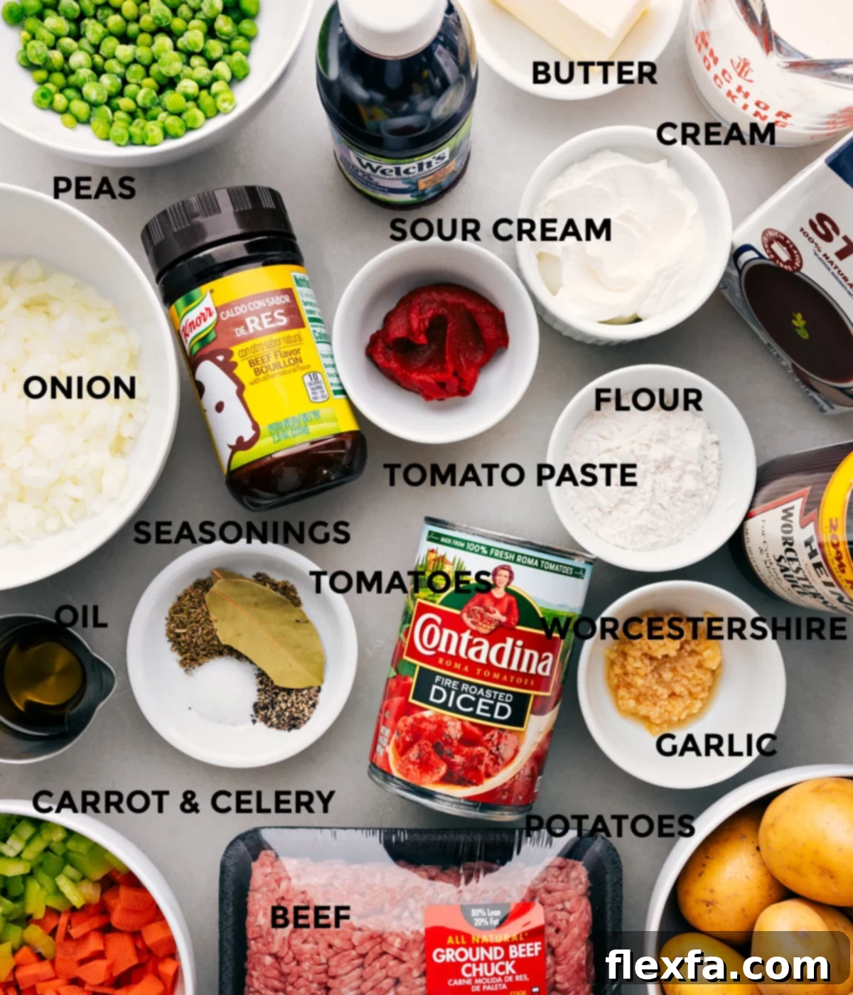 All the essential ingredients for Ground Beef Shepherd's Pie laid out, including fresh mirepoix, ground beef, frozen peas, diced tomatoes, beef stock, grape juice, Worcestershire sauce, potatoes, butter, cream, and seasonings, ready for preparation.