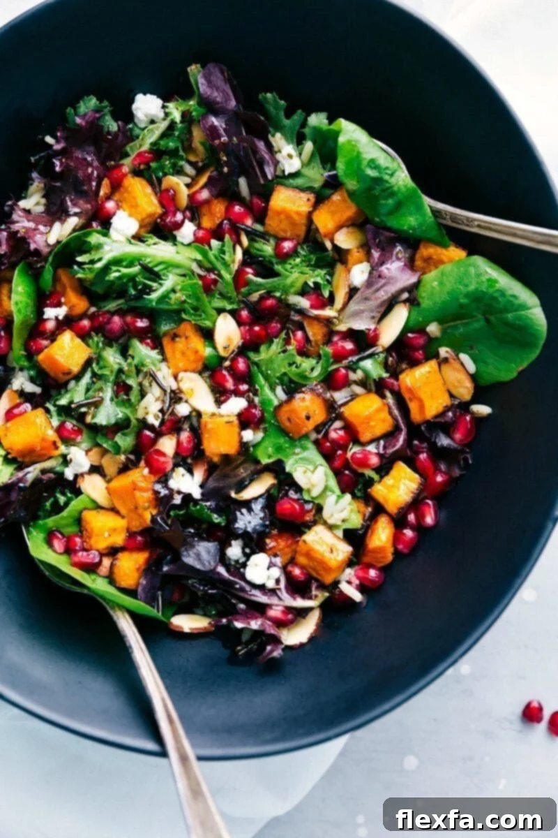 Bowl brimming with vibrant pomegranate salad, a cherished dish on our Thanksgiving dinner menu, offering a fresh contrast.