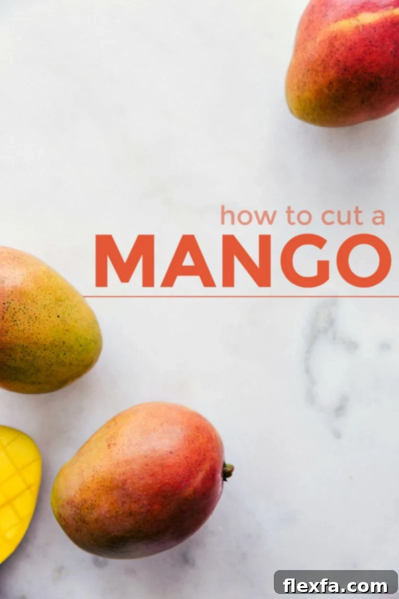 Two perfectly ripe mangoes on a marble cutting board, with the title 'How to Cut a Mango' overlaid, suggesting a detailed tutorial.