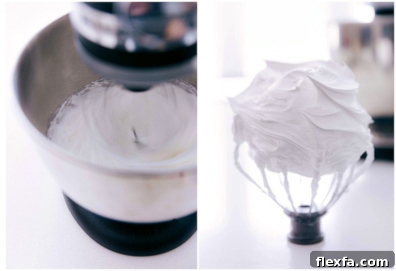 A close-up shot of egg whites and sugar being vigorously whipped together in a metal bowl, forming stiff peaks.