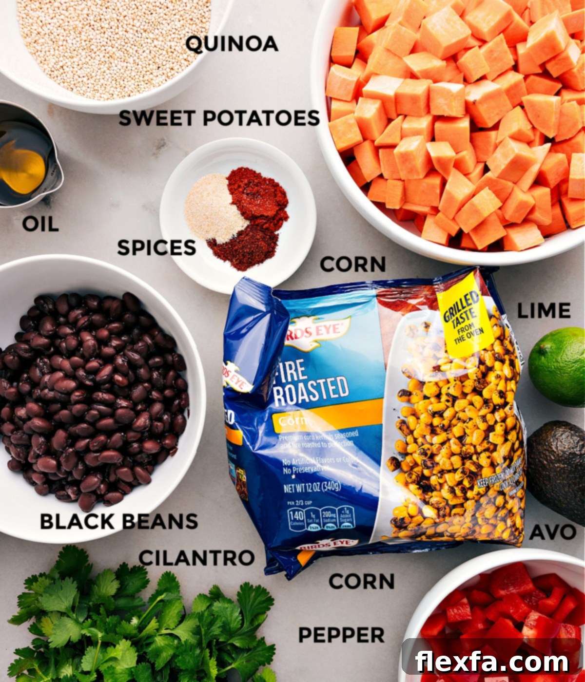 All the vibrant ingredients for Quinoa Black Bean Salad prepped and ready for easy assembly, including beans, corn, grains, diced sweet potatoes, bell pepper, spices, lime, and olive oil.