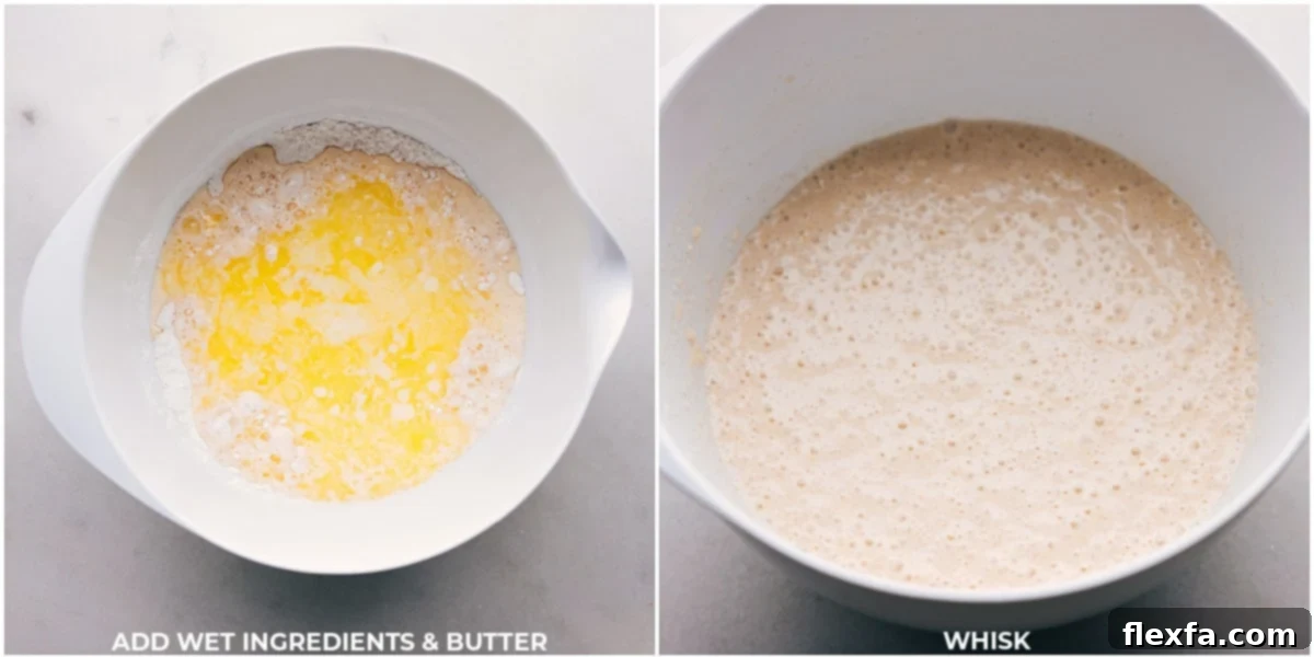 A close-up view of pancake batter being gently mixed, showing the ideal slightly lumpy consistency for fluffy old-fashioned pancakes.