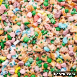 A bowl of colorful Leprechaun Bait snack mix, coated in white chocolate and ready to eat.
