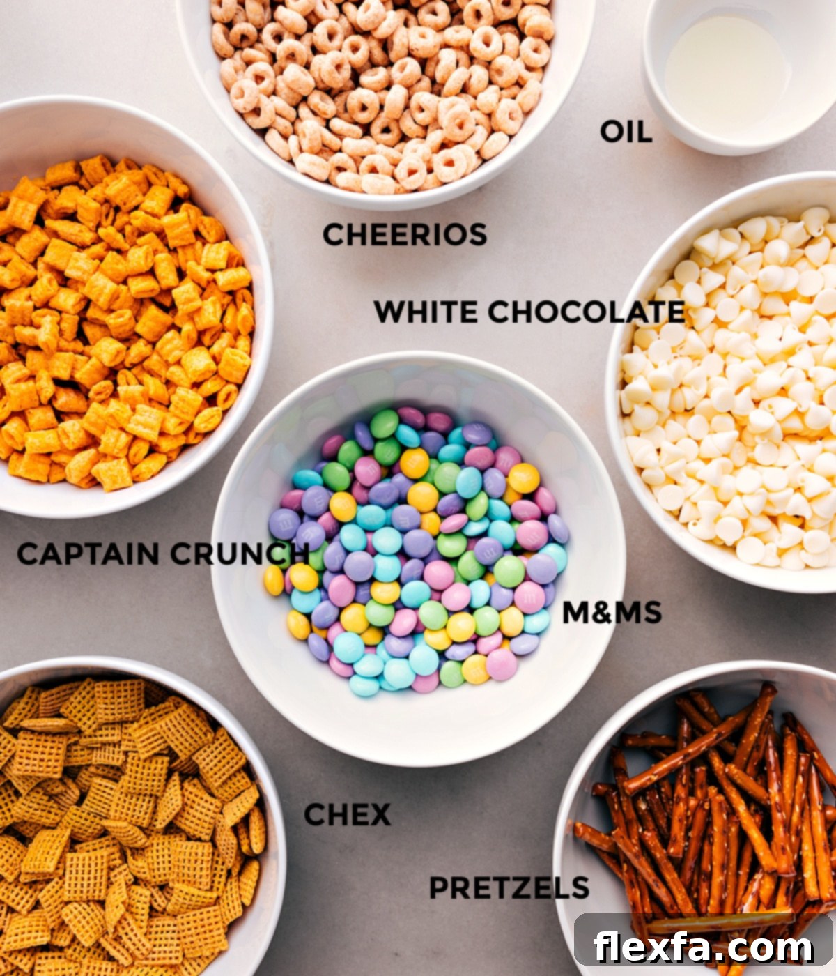 Essential Ingredients for Making Bunny Bait All the Bunny Bait ingredients laid out: Chex cereal, Cheerios, Cap’n Crunch, mini pretzels, pastel M&M's, white chocolate chips, and vegetable oil.