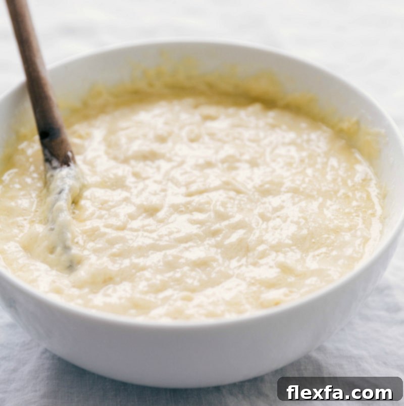 Waffle batter perfectly mixed in a bowl, ready to be poured into the waffle iron for light, fluffy, and crispy waffles.