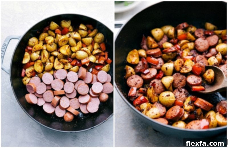 Adding flavorful smoked sausage to the skillet with peppers and potatoes for a quick and easy 20-minute dinner. Smoked sausage slices being added to the sautéed red bell peppers and crispy potatoes in a large skillet, ready to be combined for the delicious one-pan meal.