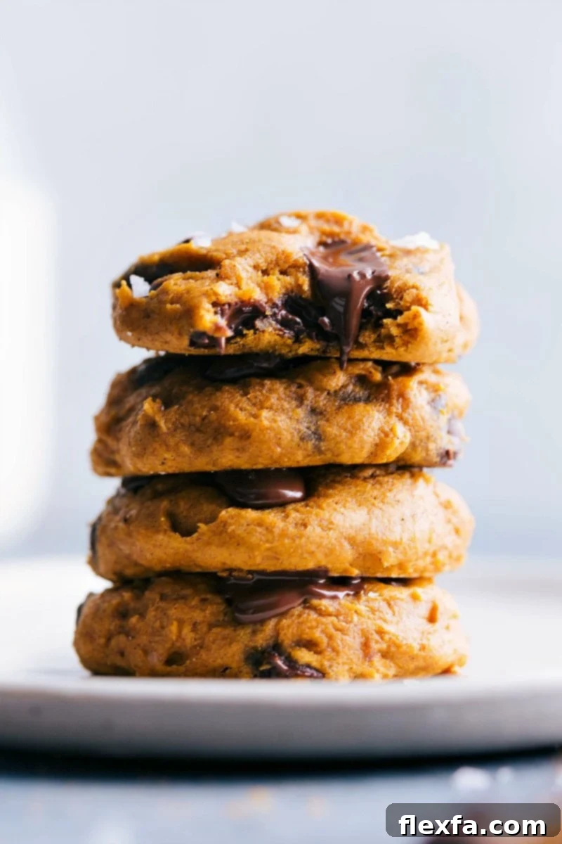 Freshly Baked Cake Mix Pumpkin Cookies Stacked Stack of cake mix pumpkin cookies, freshly baked with a golden-brown hue, ready for serving.
