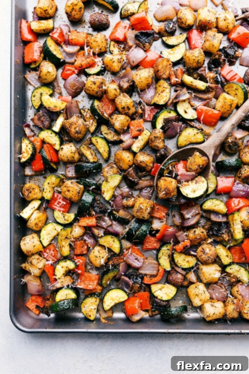Finished baked gnocchi and roasted vegetables meal cooked to perfection, warm and ready to be served on a plate.