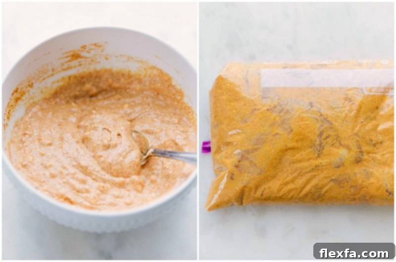 Close-up of boneless, skinless chicken pieces being thoroughly mixed in a large bowl with a rich, creamy, and vibrantly spiced yogurt marinade. The chicken is evenly coated and ready to absorb maximum flavor for the Tikka Masala.