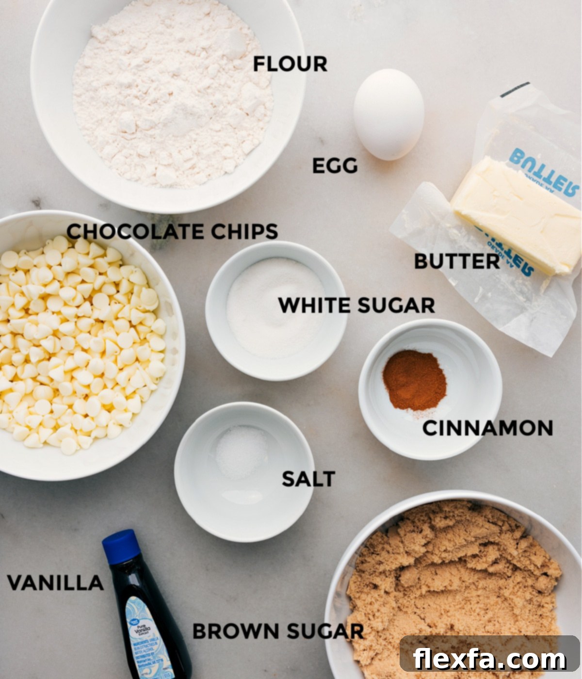 All the ingredients in the recipe including chocolate chips, egg, sugar, cinnamon, salt, butter, and flour, prepped out for easy assembly of this recipe.