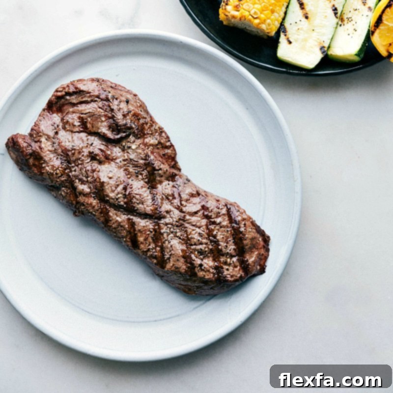 Simple & Delicious Flat Iron Steak 2 A perfectly grilled flat iron steak, just off the grill, showcasing the easiest and tastiest flat iron steak recipe for a delicious meal.