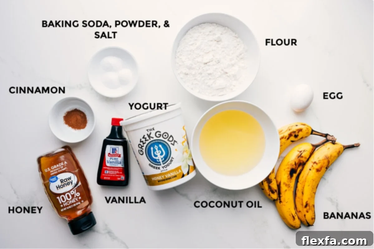Key Ingredients for Deliciously Healthy Banana Muffins All the essential ingredients for healthy banana muffins neatly prepped on a counter, including flour, eggs, ripe bananas, coconut oil, Greek yogurt, baking soda, baking powder, salt, cinnamon, vanilla extract, and honey.