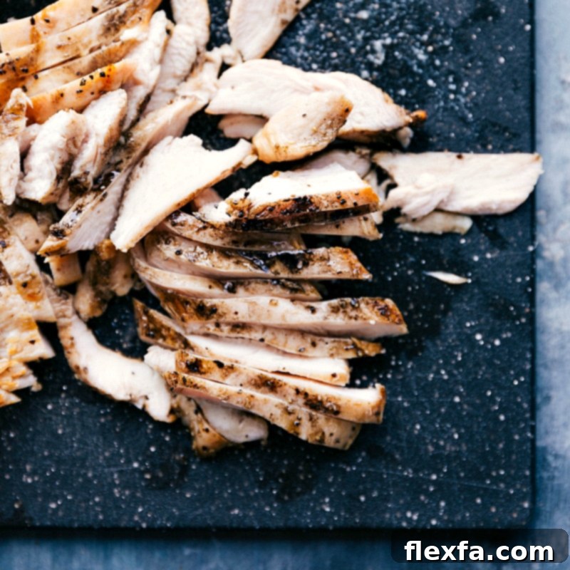 Perfectly cooked and tender chicken breast, sliced and ready to be incorporated into the apricot chicken recipe, showcasing its juicy texture.
