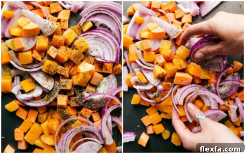 Chopped Vegetables Seasoned and Prepared for Roasting on a Sheet Pan Freshly chopped sweet potatoes, butternut squash, and red onions, expertly seasoned and spread on a sheet pan, prepared for roasting.