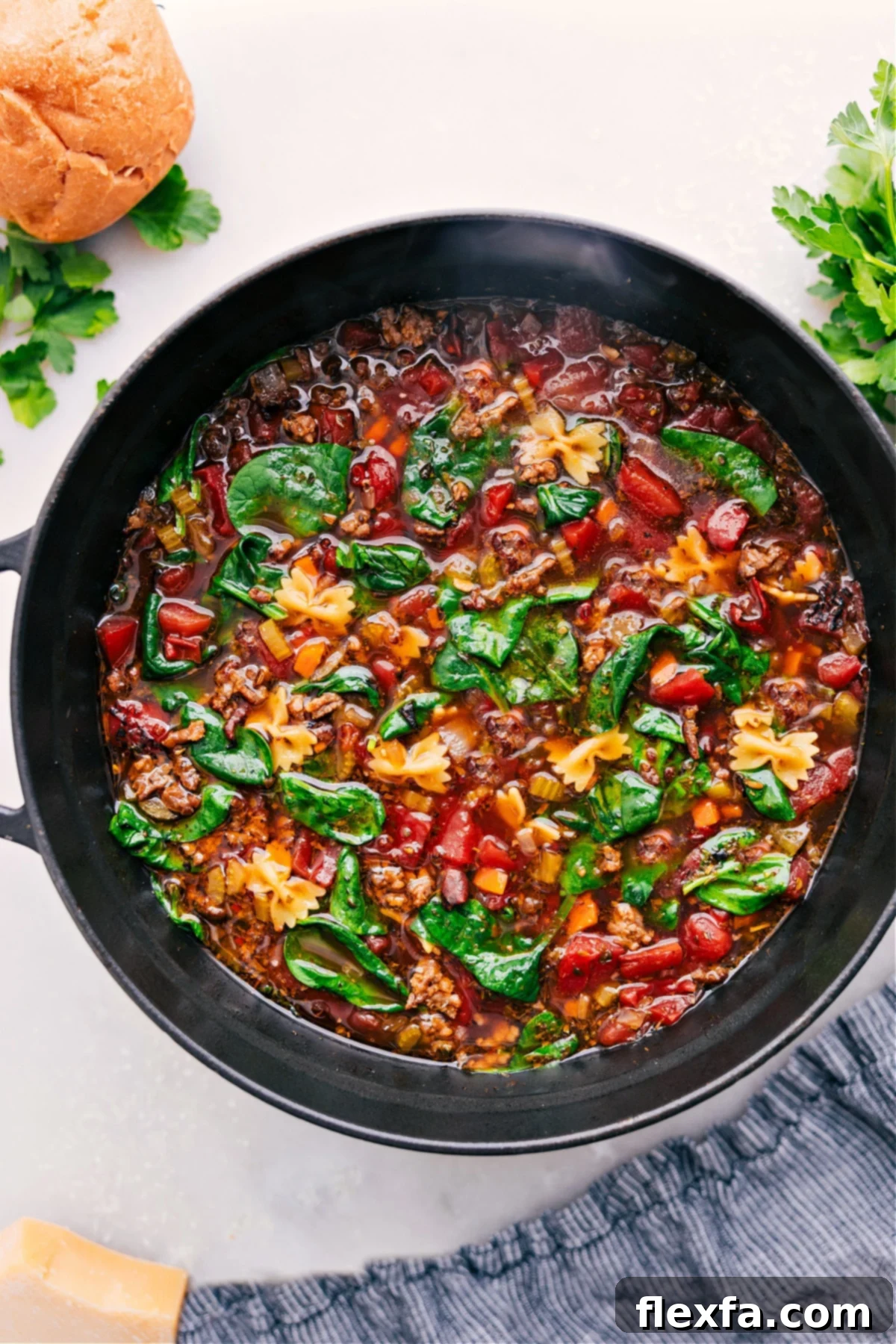 A steaming bowl of hearty Pasta Soup, ready to be enjoyed, showcasing its rich colors and textures.