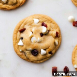 Warm, freshly baked white chocolate cranberry cookies, golden brown and ready to be savored.