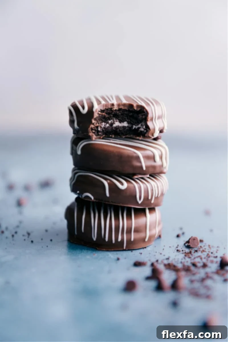Homemade Chocolate Covered Oreos: Easy, Rich, and Perfectly Decorateable Treats Stacked Chocolate Covered Oreos with sprinkles on a festive background, showcasing their rich chocolate coating and creamy center