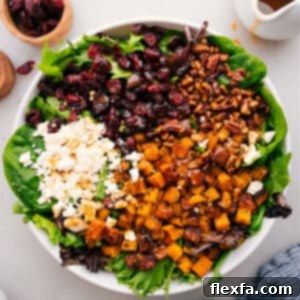 Autumn Harvest Thanksgiving Salad 3 Thanksgiving Salad with roasted butternut squash, candied nuts, feta, and dried cranberries.