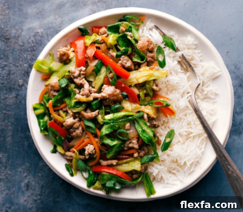 Egg roll in a bowl filling served over a bed of rice, prepared and ready for a delicious meal.