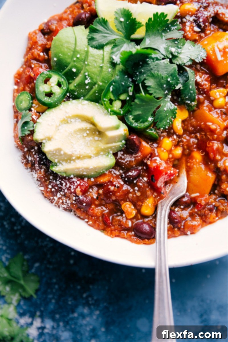 A freshly cooked batch of Mexican Quinoa in a slow cooker, steaming and ready to be served, garnished with fresh cilantro.