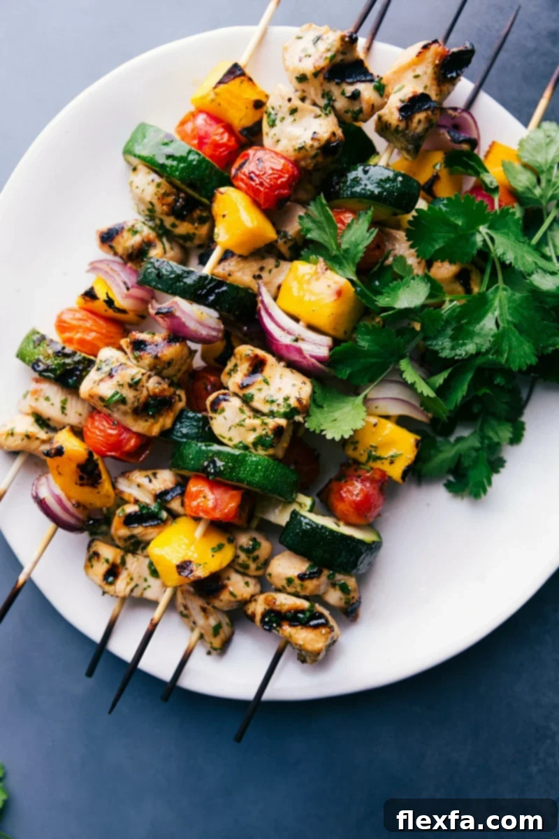 Delicious Grilled Chicken Kabobs: Perfectly Cooked and Ready to Enjoy Gorgeous, vibrant chicken kabobs on a plate, grilled to perfection, and ready to eat.