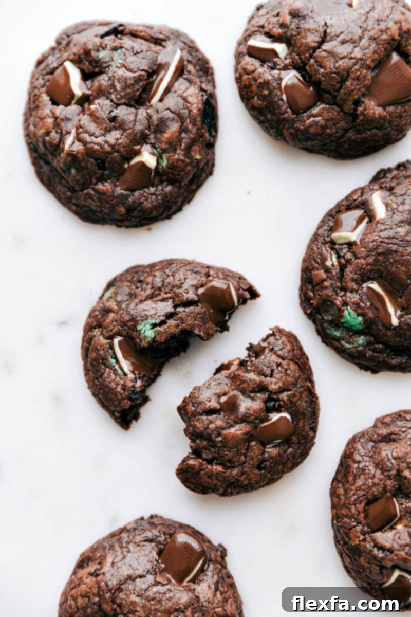 A plate of freshly baked Mint Chocolate Chip Cookies, garnished with extra mints