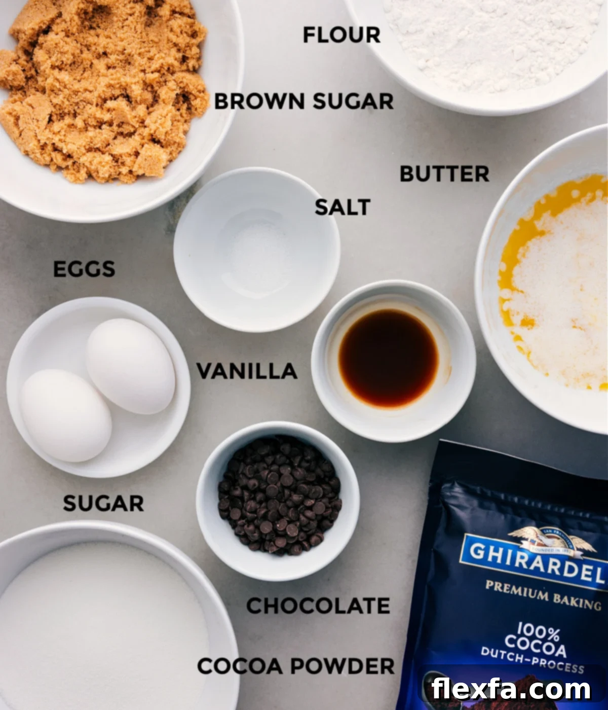 All the essential ingredients for this incredible brownie recipe: unsalted butter, granulated sugar, light brown sugar, eggs, vanilla extract, all-purpose flour, Dutch-processed cocoa powder, salt, and mini chocolate chips, neatly prepped for easy assembly.